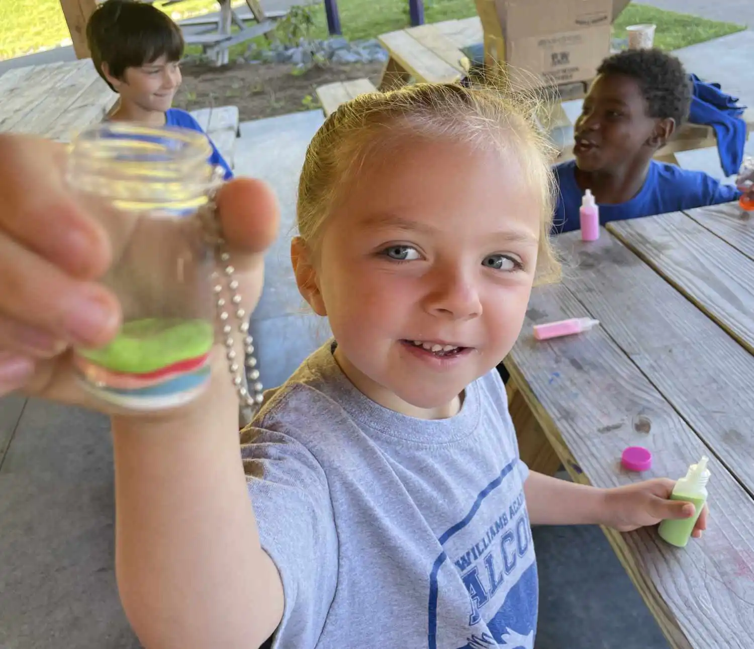 Williams Academy students creating sand art